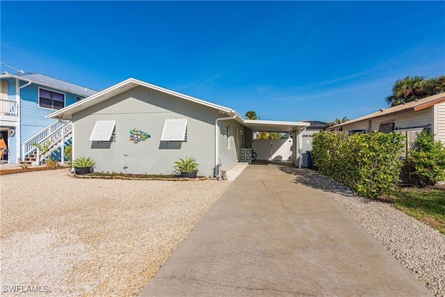 view of front of home featuring a carport