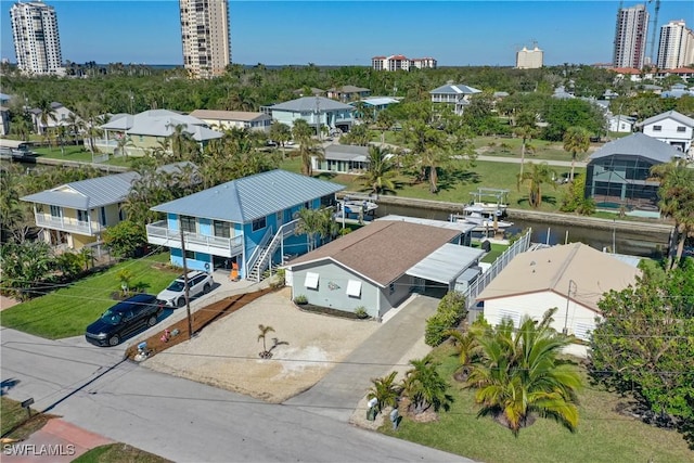 drone / aerial view featuring a residential view and a city view