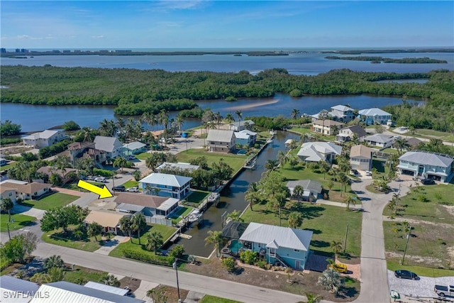 bird's eye view with a water view