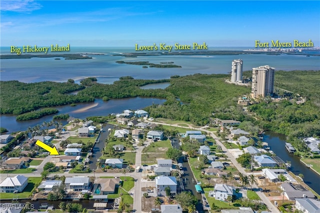 birds eye view of property featuring a water view