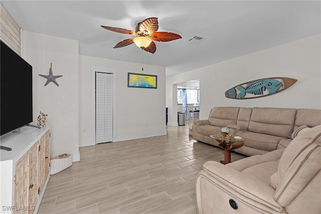 living room with ceiling fan