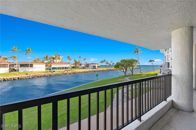 balcony featuring a water view