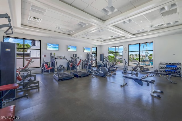 workout area featuring a paneled ceiling and ceiling fan