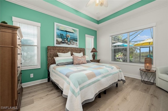 bedroom featuring light wood-type flooring, baseboards, and crown molding