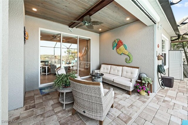 view of patio featuring an outdoor hangout area and a ceiling fan