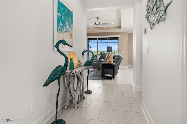 17773 Vaca Ct, Fort Myers, FL 33908 - corridor with a tray ceiling, ornamental molding, baseboards, and tile patterned flooring
