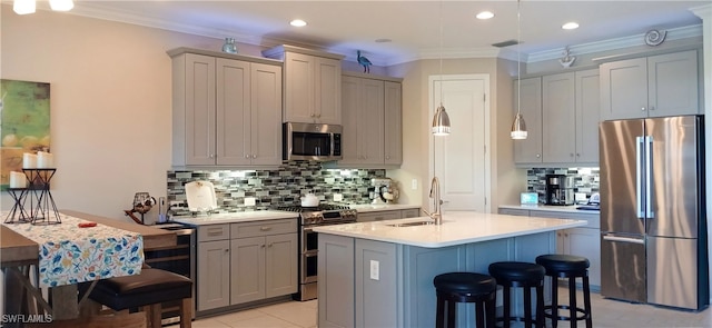 17773 Vaca Ct, Fort Myers, FL 33908 - kitchen with stainless steel appliances, a sink, gray cabinetry, backsplash, and light countertops