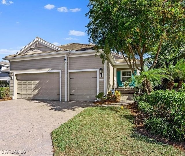 17773 Vaca Ct, Fort Myers, FL 33908 - view of front of property featuring an attached garage and driveway