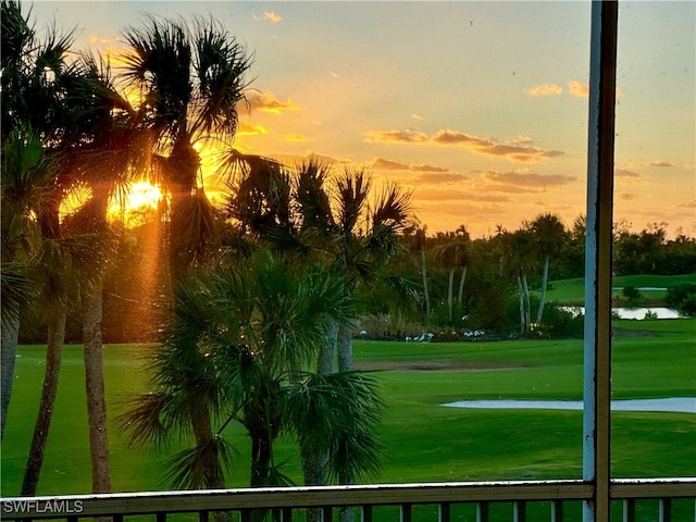 surrounding community featuring a yard and a water view