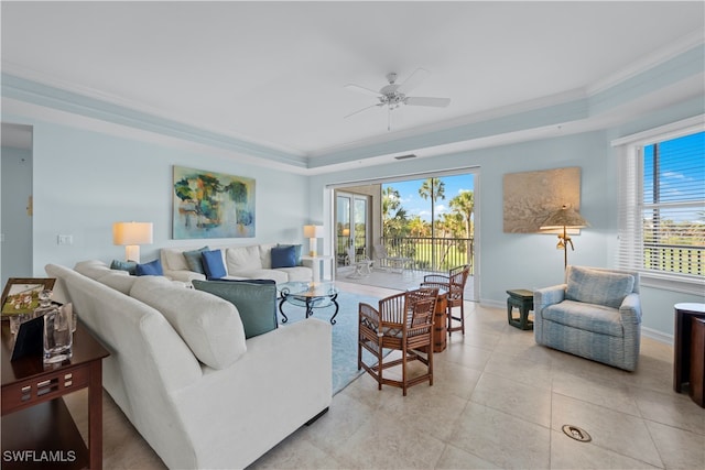 living room with ceiling fan, light tile patterned flooring, and ornamental molding