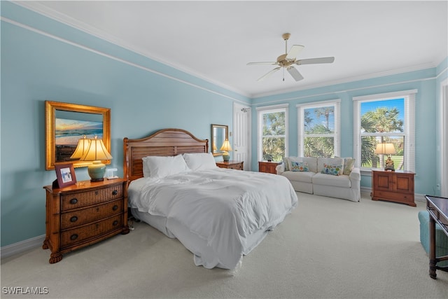 bedroom with carpet, ceiling fan, and crown molding