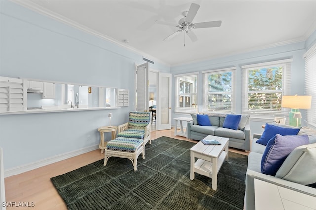 sunroom / solarium featuring ceiling fan