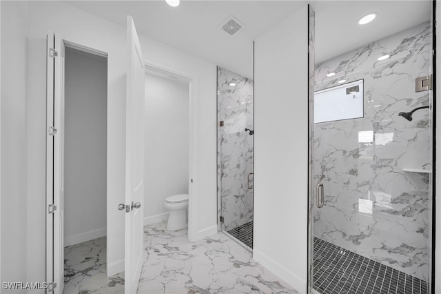 bathroom featuring toilet and walk in shower