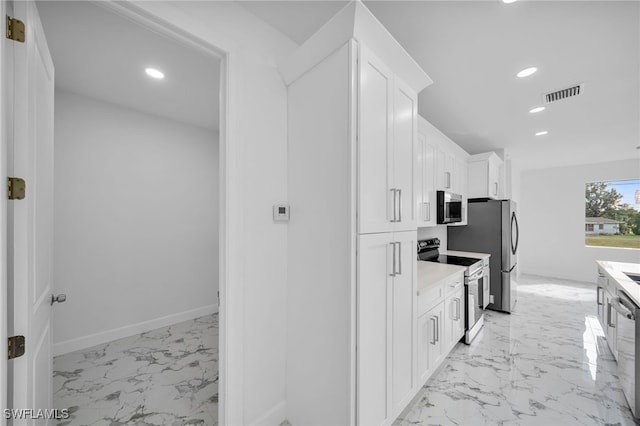 kitchen featuring white cabinetry and stainless steel appliances