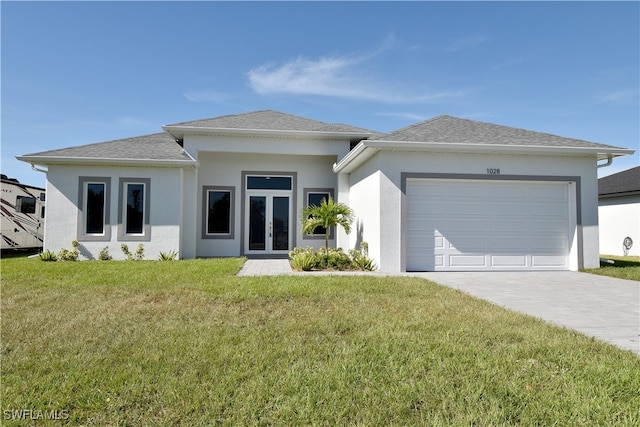 view of front of property with a front lawn and a garage