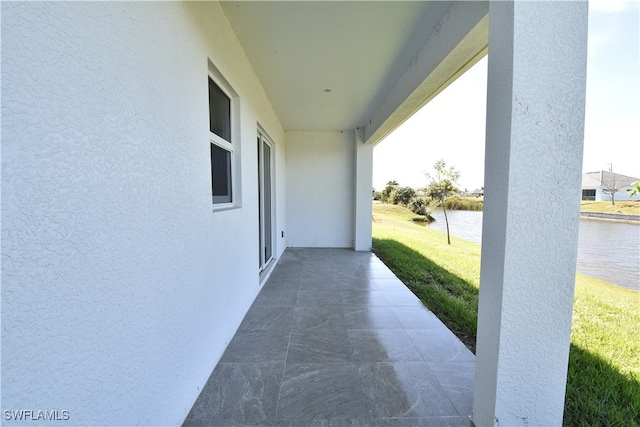 view of patio featuring a water view