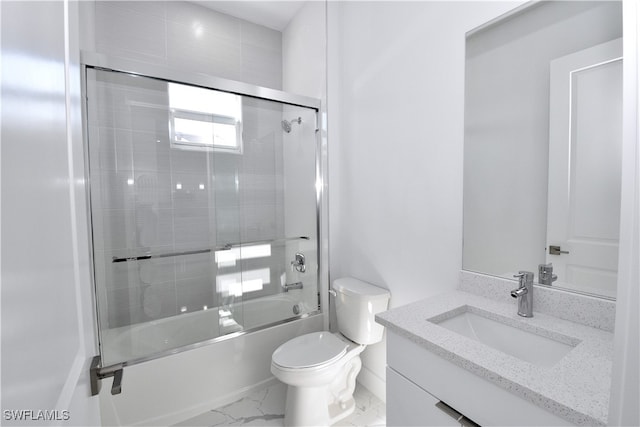 full bathroom with vanity, toilet, and bath / shower combo with glass door