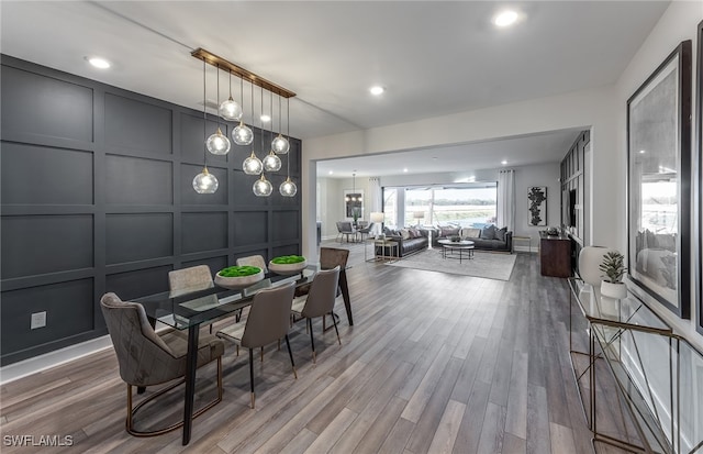 dining space featuring a chandelier and hardwood / wood-style flooring