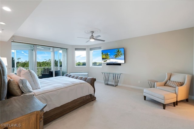 carpeted bedroom featuring access to exterior, multiple windows, and ceiling fan