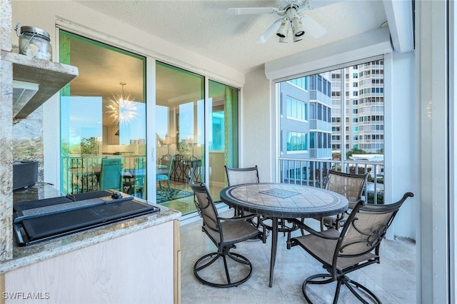 balcony featuring ceiling fan