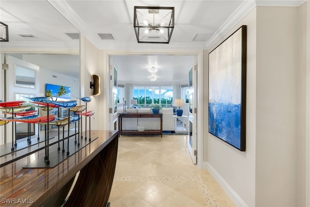 hall with crown molding and a chandelier