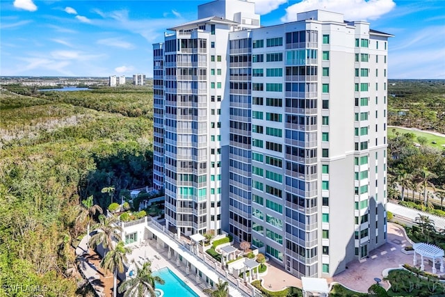 view of building exterior with a community pool