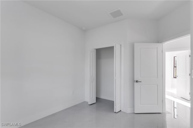 unfurnished bedroom with a closet