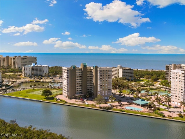 birds eye view of property with a water view