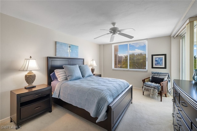 bedroom featuring light carpet and ceiling fan