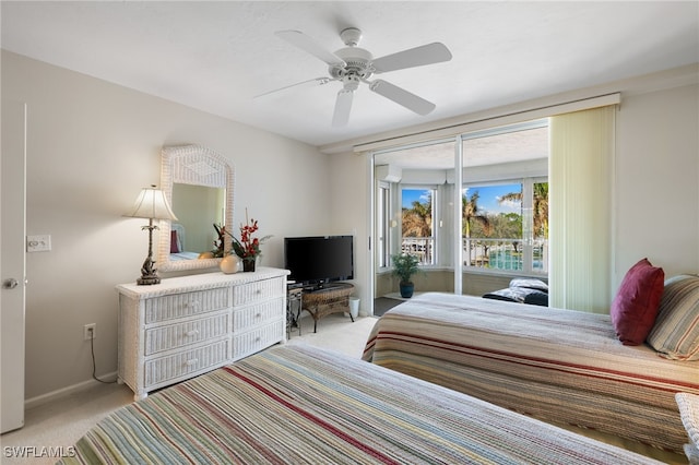 carpeted bedroom featuring access to outside and ceiling fan