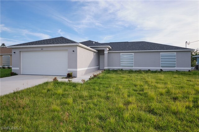 ranch-style house with a garage and a front yard