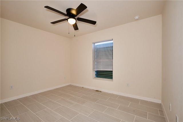 unfurnished room with ceiling fan