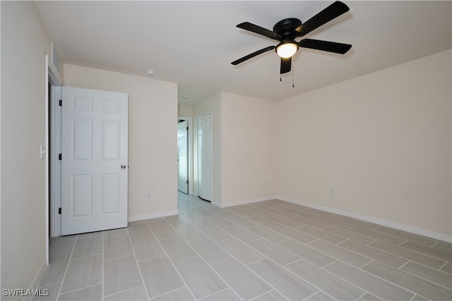 empty room featuring ceiling fan