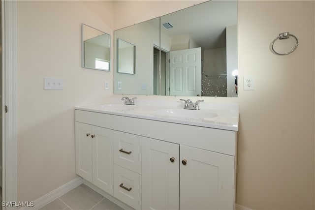 bathroom with tile patterned flooring and vanity