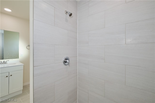 bathroom featuring vanity and a tile shower