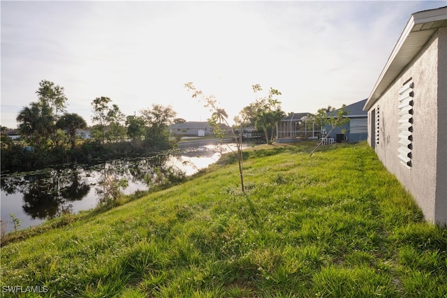 view of yard with a water view