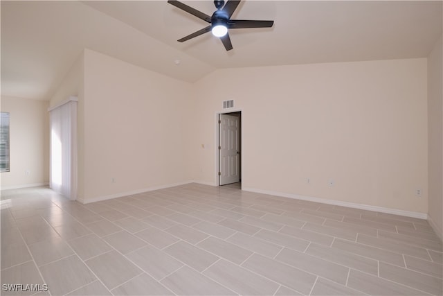 unfurnished room featuring ceiling fan, light tile patterned flooring, and lofted ceiling