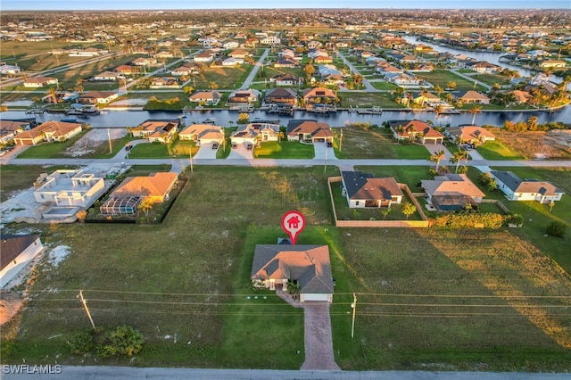 drone / aerial view with a water view