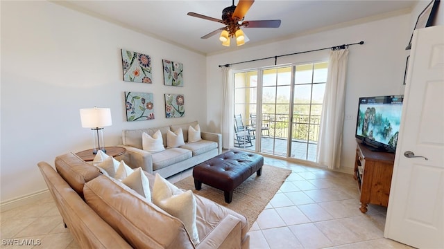 tiled living room featuring ceiling fan and ornamental molding