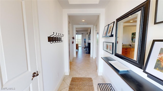 hallway featuring light tile patterned flooring