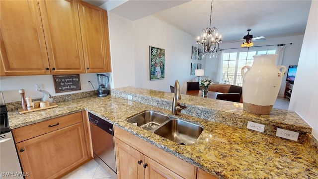 kitchen featuring light stone countertops, sink, stainless steel dishwasher, and ceiling fan with notable chandelier