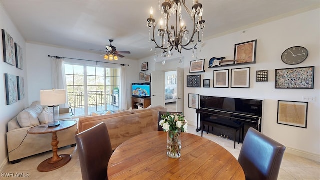 dining room with light tile patterned floors, ceiling fan with notable chandelier, and crown molding