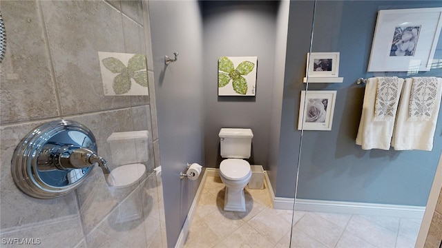 bathroom featuring tile patterned flooring and toilet