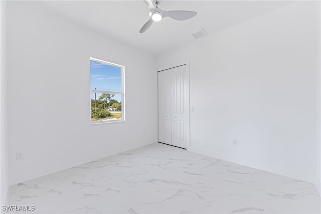 spare room featuring ceiling fan