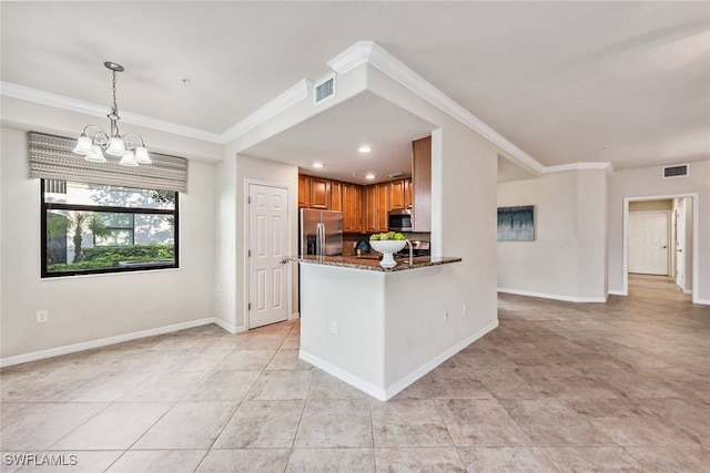 kitchen with dark stone counters, crown molding, kitchen peninsula, stainless steel appliances, and a chandelier