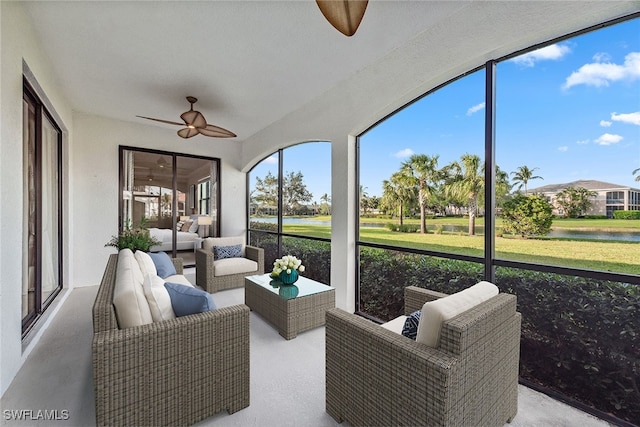 sunroom featuring ceiling fan