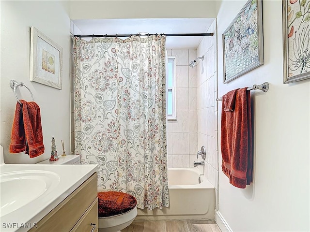 full bathroom with shower / tub combo, vanity, and toilet