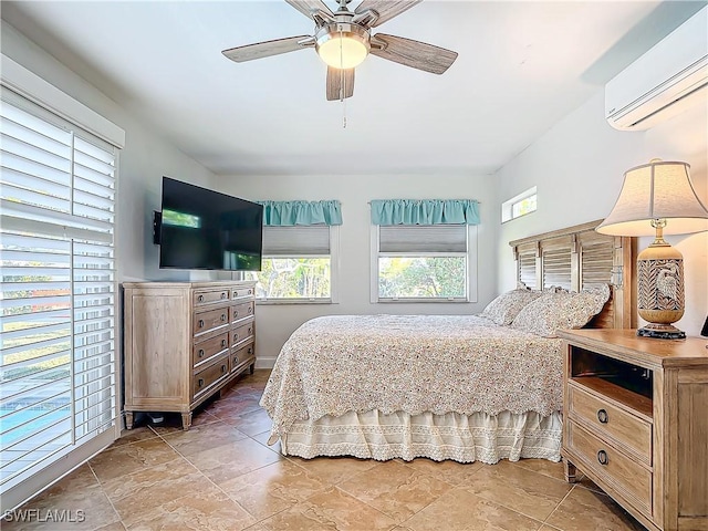 bedroom featuring a wall unit AC and ceiling fan