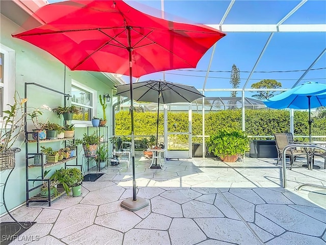 view of patio / terrace featuring a lanai