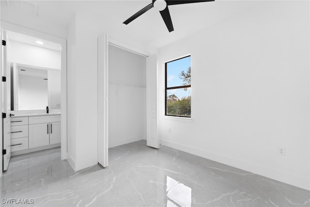 unfurnished bedroom featuring ceiling fan and a closet